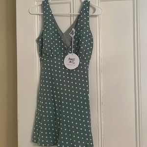 Green dress with white polka dots brand new